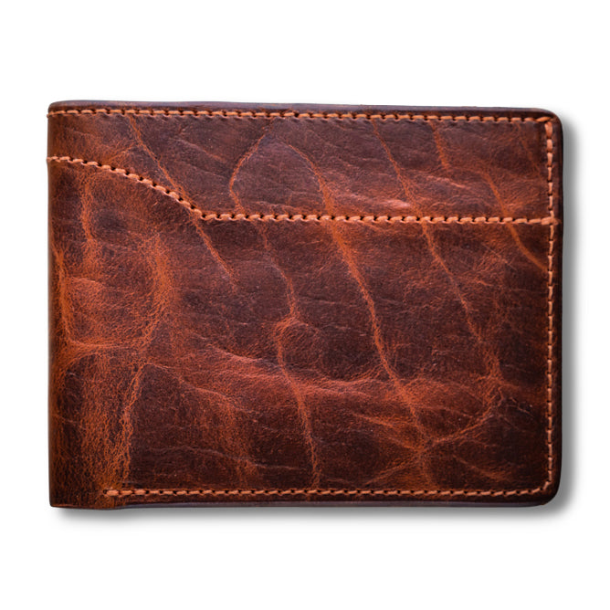 The Hanks Belts Powell Bison Bifold with ID Window Flap, featuring visible stitching and a textured, slightly worn surface, is shown against a white background.