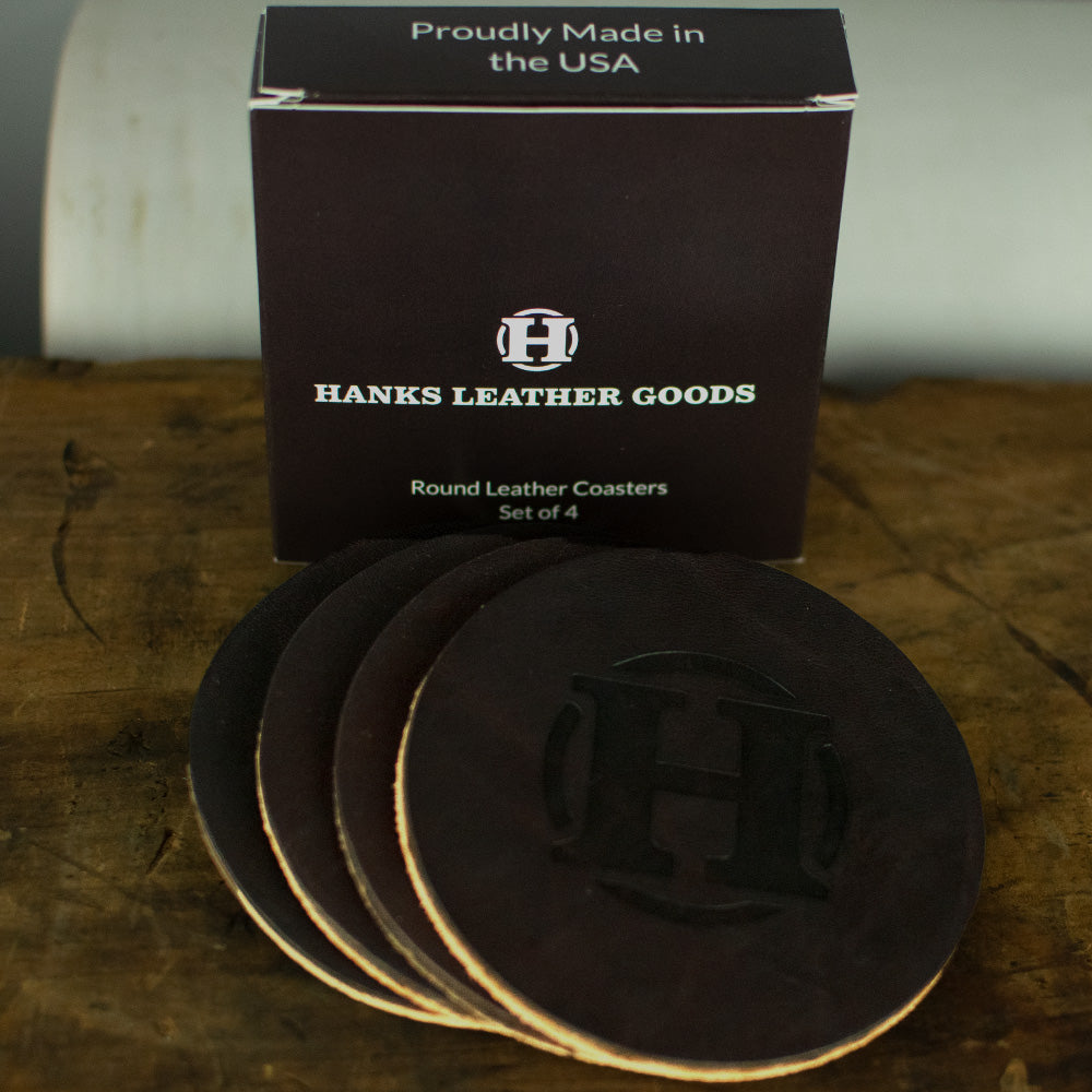 Set of 4 round leather coasters with box for packaging in rich brown