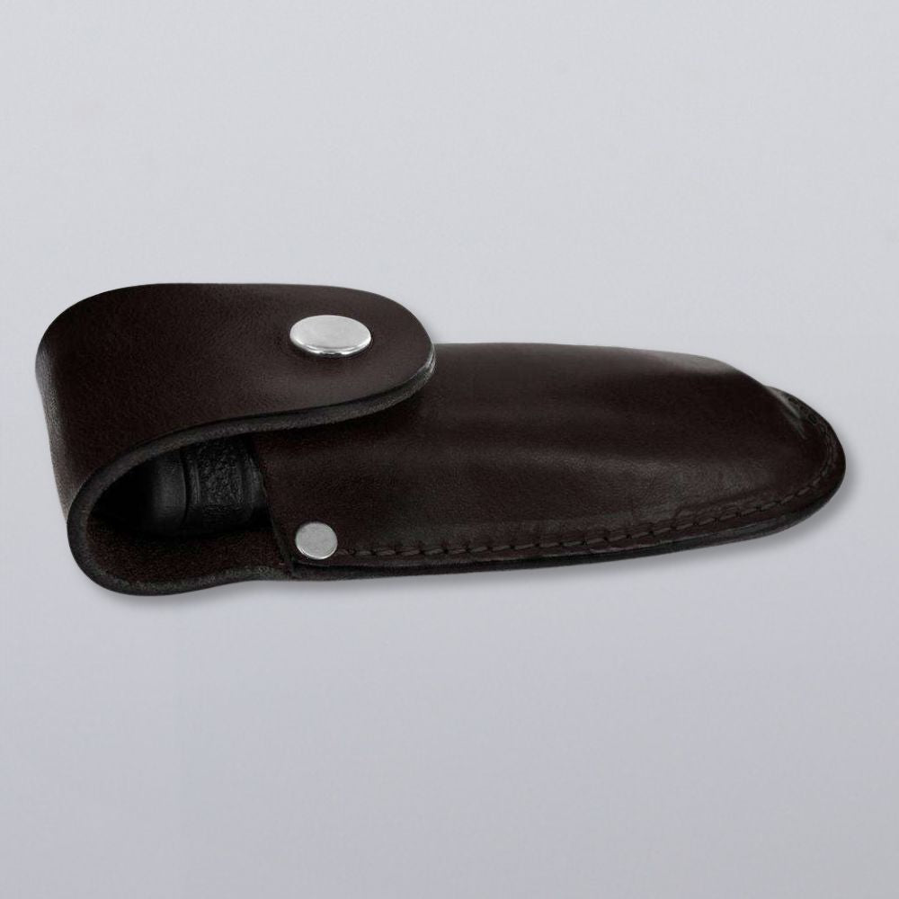A closed dark brown Canyon Utility Sheath and Mag Case by Hanks Belts, crafted from bridle leather with a silver snap button flap, shown on a plain light gray background.