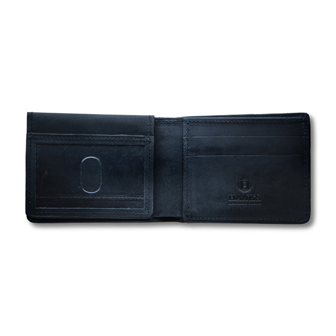 The Huron Premium Bifold with ID Window by Hanks Belts is an open black wallet made from premium steerhide leather, featuring multiple card slots and a transparent ID window, displayed on a white background.