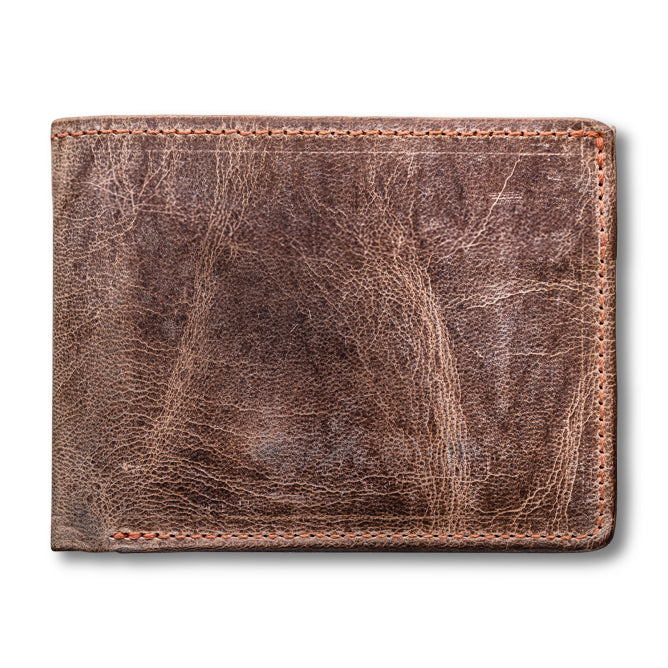 The Huron Premium Bifold with ID Window by Hanks Belts is a closed, brown, distressed steerhide leather wallet with visible stitching, crafted in the USA and shown against a white background.