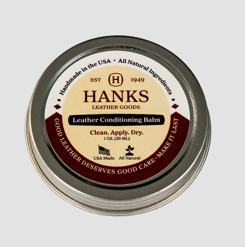 A round tin of Hanks Belts Leather Conditioning Balm, labeled “Handmade in the USA,” is the premium care your CCW belts deserve—good leather lasts longer with quality conditioner.