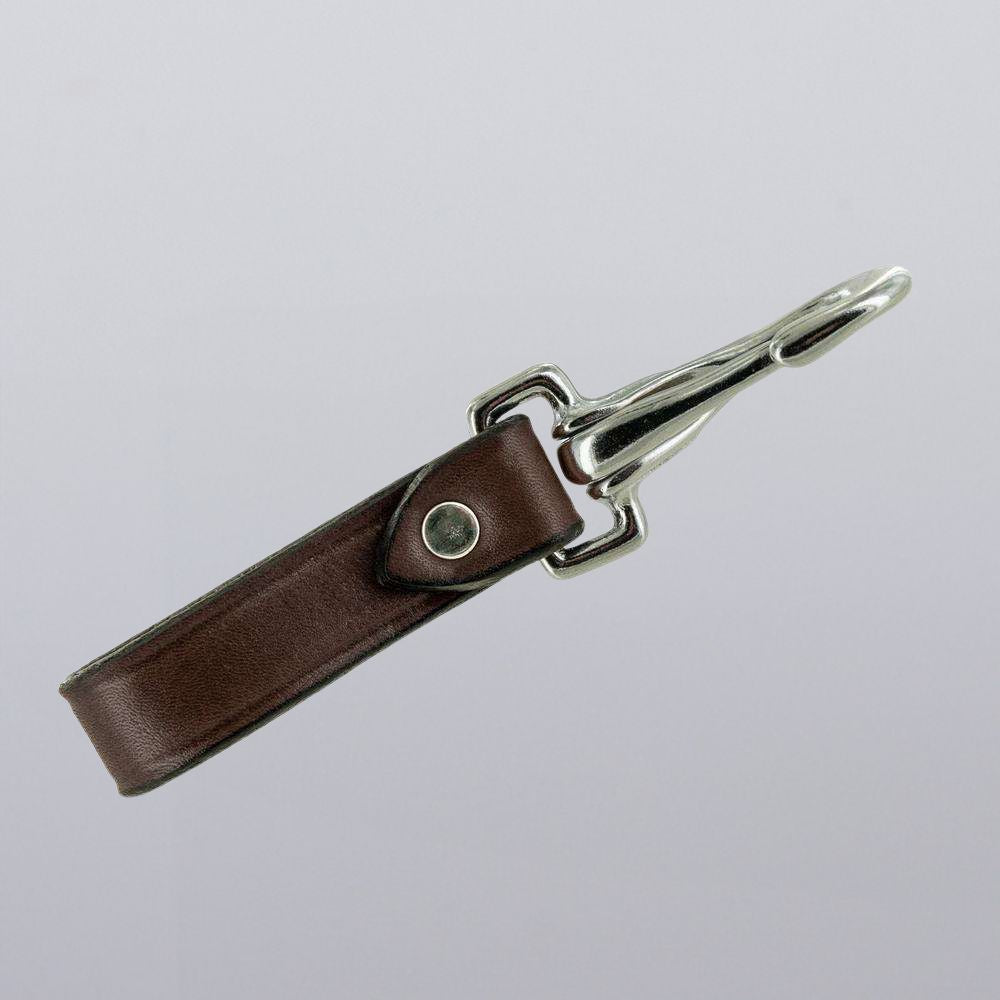 The Canyon Keychains by Hanks Belts feature brown leather with a silver metal clasp and rivet, ideal for organizing key fobs. Shown on a plain light gray background.