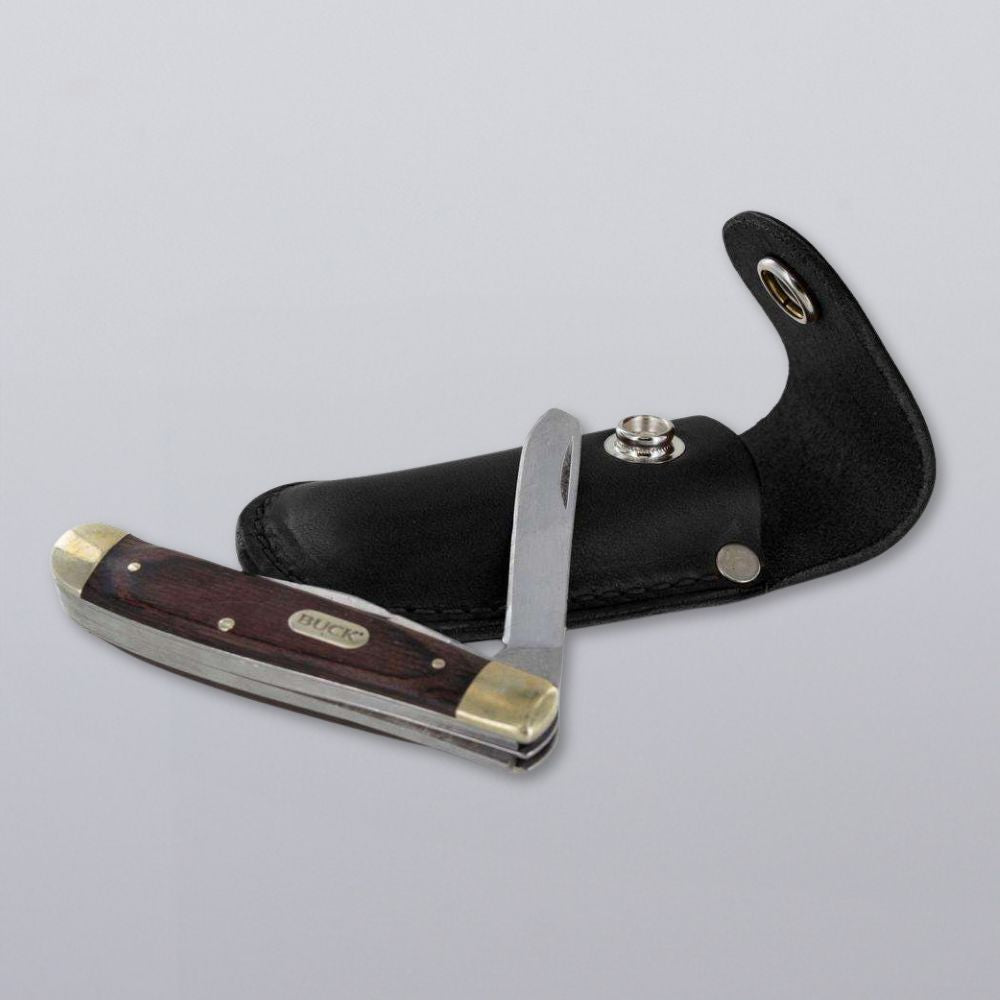 The Canyon Utility Sheath and Mag Case by Hanks Belts is shown partially open, featuring a wooden handle with brass ends, resting on a handcrafted USA leather sheath against a plain light gray background.