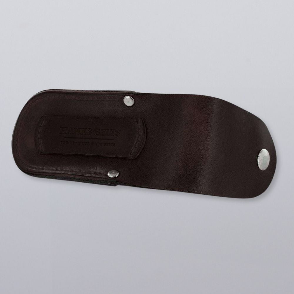 A dark brown bridle leather Canyon Utility Sheath and Mag Case from Hanks Belts with silver snap closures rests on a light grey surface, featuring the stylish embossed "Hanks Belts" logo.