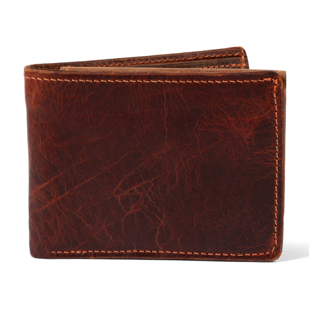 The Hanks Belts Powell Bison Bifold with ID Window is a closed brown bison leather wallet with visible stitching, textured surface, and ample card storage, displayed against a white background.