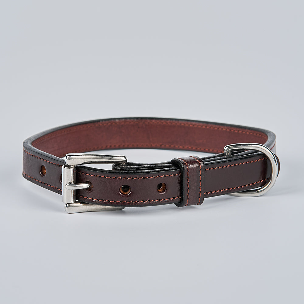 The Hanks Belts Old Reliable Collar is a dark brown, premium vegetable-tanned leather dog collar with contrast stitching, a silver buckle, and D-ring, shown on a light gray background.