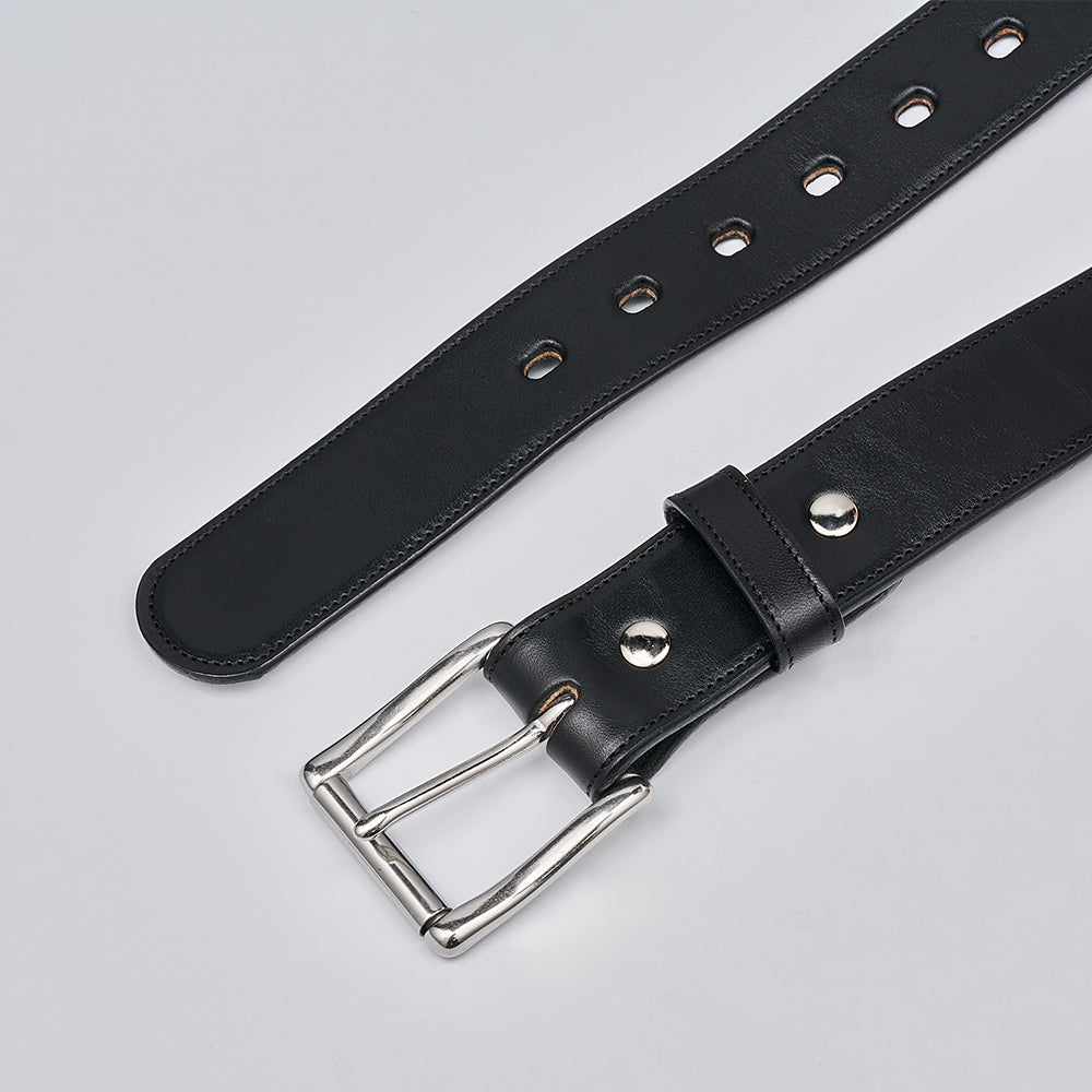 The Canyon by Hanks Belts is a handcrafted black English bridle leather belt with a silver metal buckle and circular reinforced holes, shown on a light gray background.
