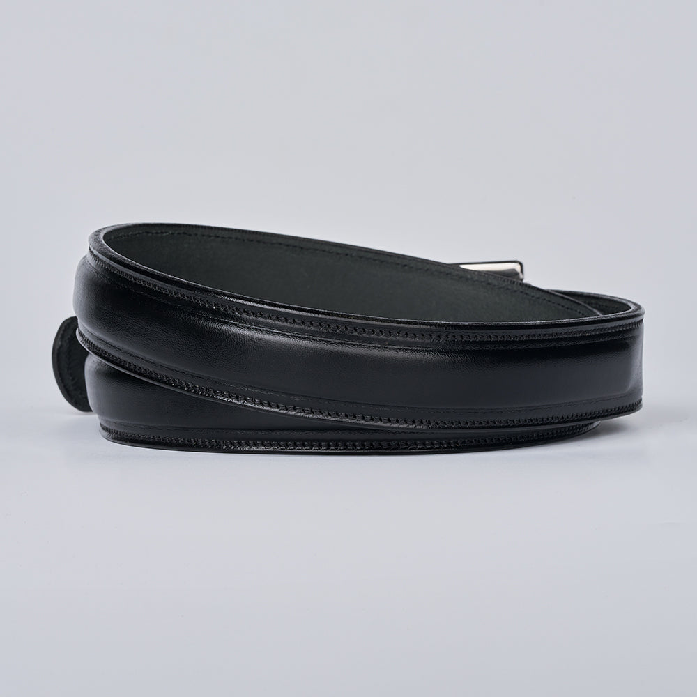 The Esquire Raised by Hanks Belts: a coiled black English Bridle leather belt with visible stitching and a silver buckle, displayed on a plain light gray background.