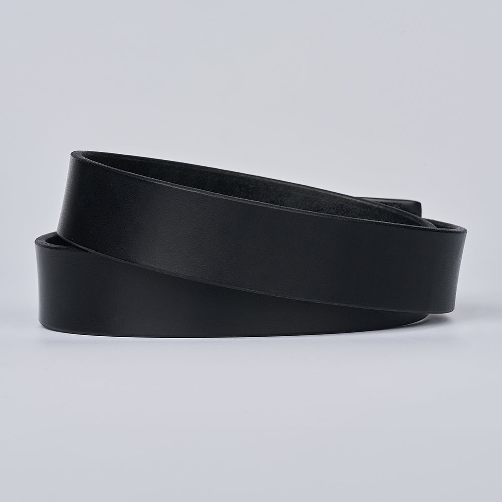 The Everyday by Hanks Belts is a coiled, full-grain leather men’s belt with no visible buckle, shown against a light gray background.