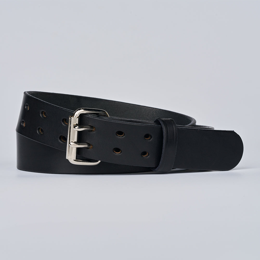 The Double Prong Everyday by Hanks Belts is a black full-grain leather belt with multiple holes and a silver buckle, coiled neatly against a plain light gray background.