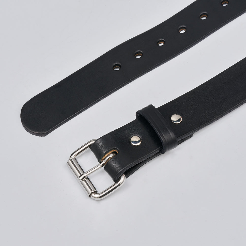 The Gunner by Hanks Belts is a black leather CCW belt with a silver metal buckle and multiple holes, displayed flat on a light gray background.