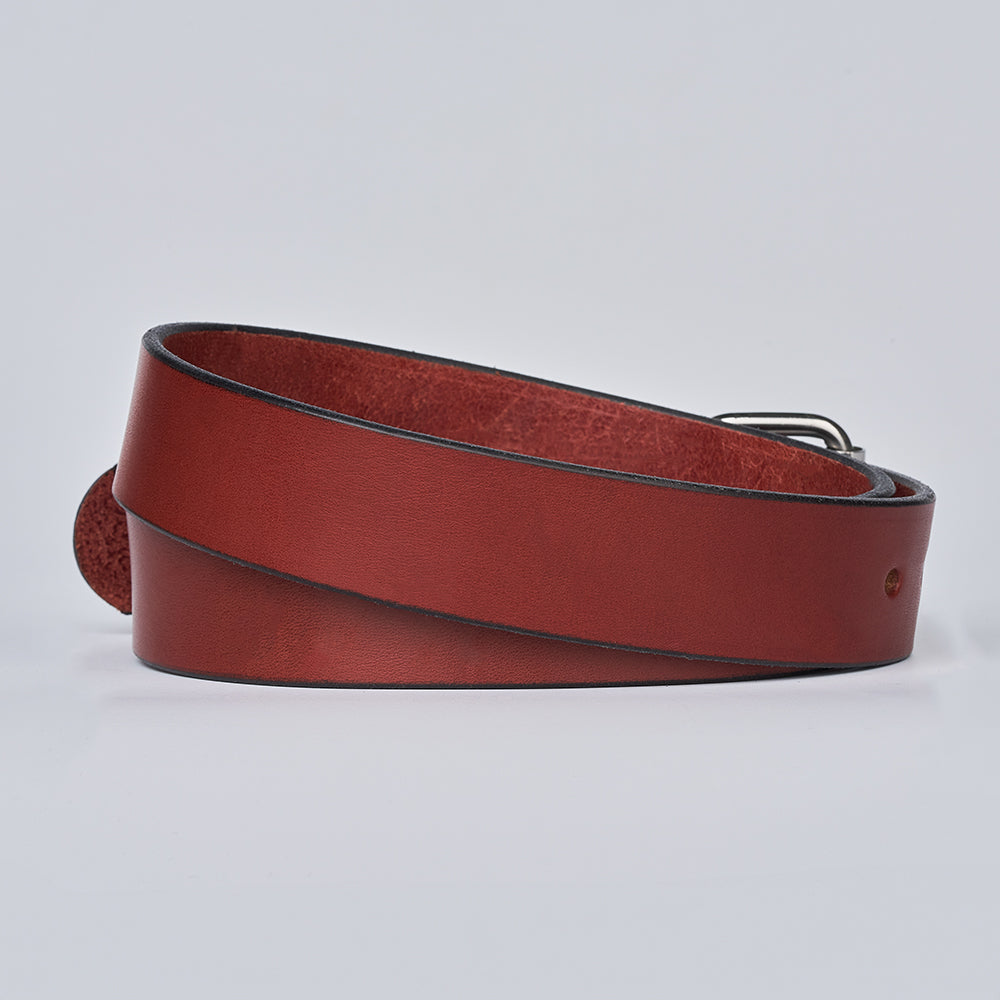 The Gunner by Hanks Belts, a coiled brown leather belt with a metal buckle, is shown on a plain white background.