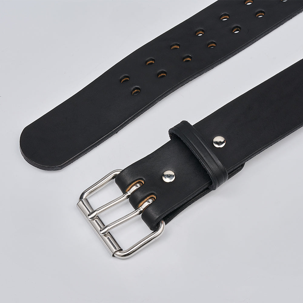 A close-up of The Marshall by Hanks Belts, a 2" wide black leather gun belt with a double-prong silver buckle and multiple adjustment holes, displayed flat on a light gray background.