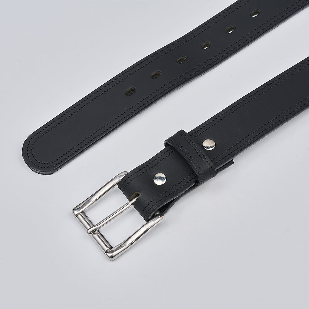 Black leather belt with silver buckle on a light gray background