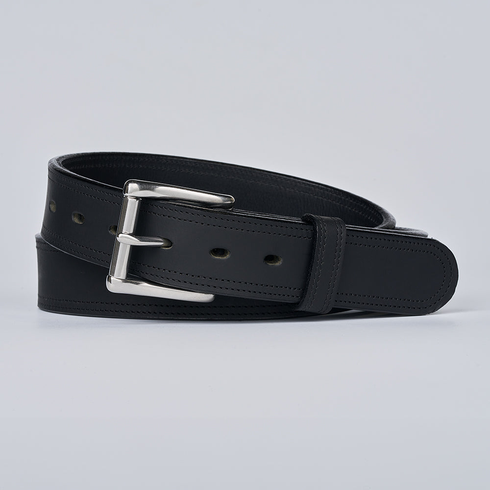 Black leather belt with a silver buckle on a light gray background