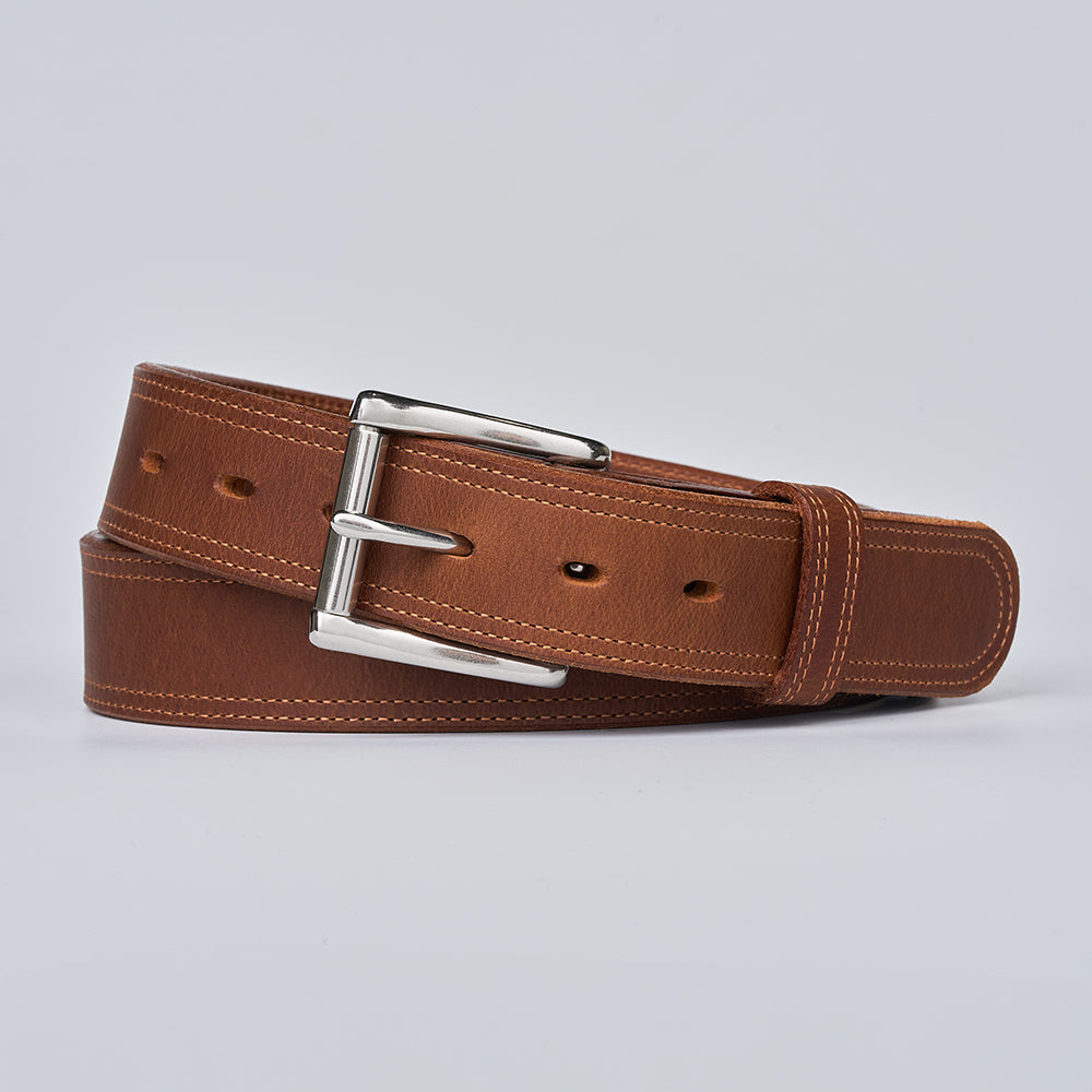 Brown leather belt with a silver buckle on a light gray background