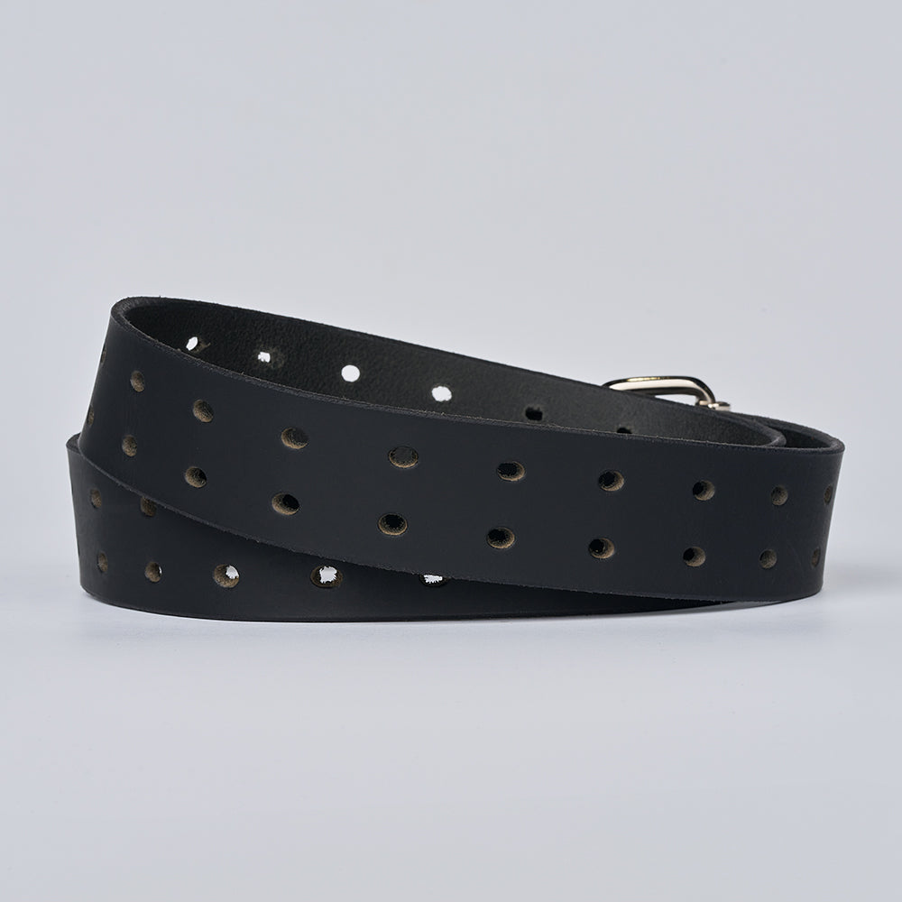 The Woodstock Double Prong Retro Style by Hanks Belts is a black full grain leather belt with multiple rows of round holes, coiled on a light gray background, partially showing its silver buckle.