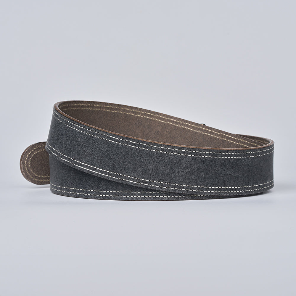 The Wyoming Bison by Hanks Belts is a rolled-up, dark gray belt with white edge stitching, shown on a light gray background—a lightweight, casual accessory ideal for daily wear.