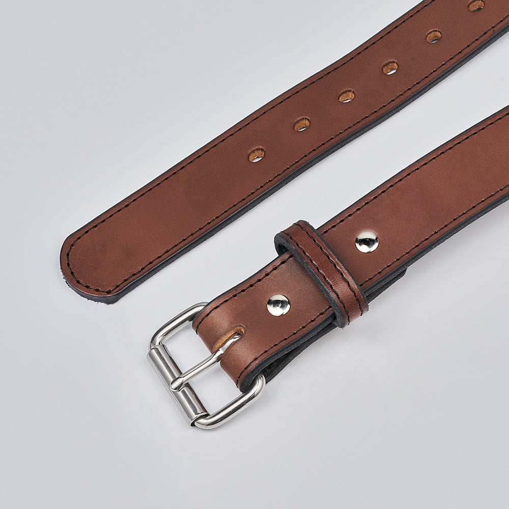 A close-up of Hanks Belts’ The Xtreme - 1.5" heavy duty leather gun belt featuring a silver buckle and multiple adjustment holes, shown on a light gray background.