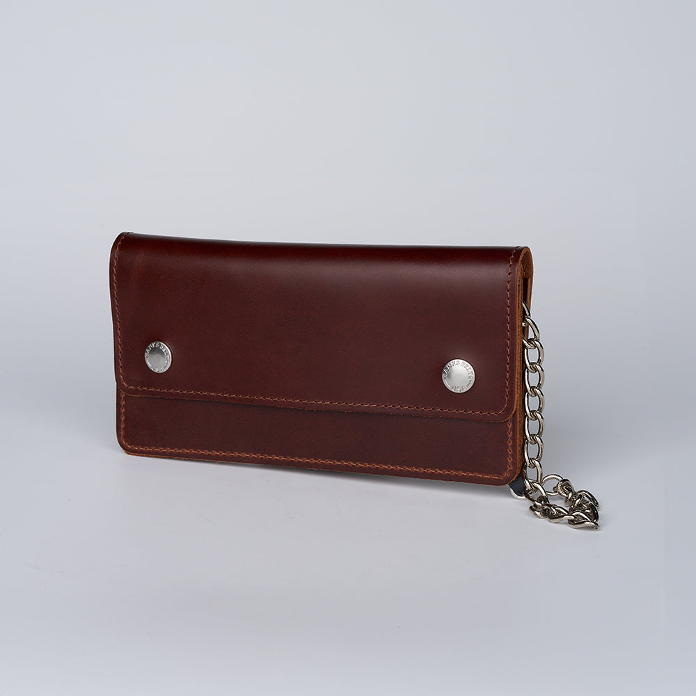 The Big Bear Biker Chain Wallet by Hanks Belts features rugged leather, two silver snap buttons, and an attached silver chain—a classic biker wallet showcased on a plain white background.