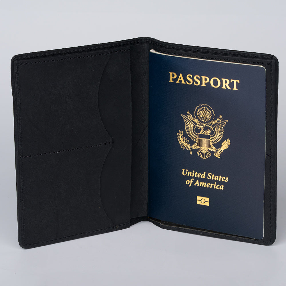 The Hanks Belts Passport Case Wallet, crafted from premium North American Steerhide, displays a U.S. passport cover with the gold seal and text. Proudly made in the USA.