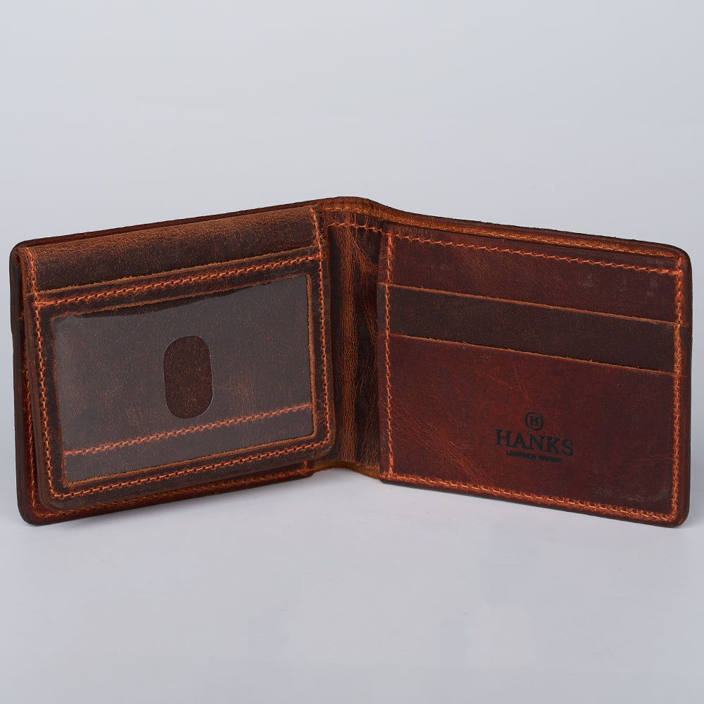 The Powell Bison Bifold with ID Window Fold Over by Hanks Belts is an open brown leather wallet with visible stitching, an ID window on the left, three card slots on the right, and "HANKS" embossed inside—ideal for gifting.