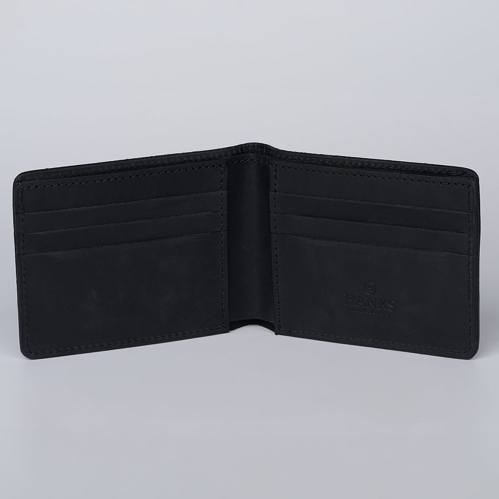 The open Tahoe Bifold wallet by Hanks Belts is shown on a plain gray background, displaying multiple card slots on both sides and "Hanks Belts" embossed on the right interior side.