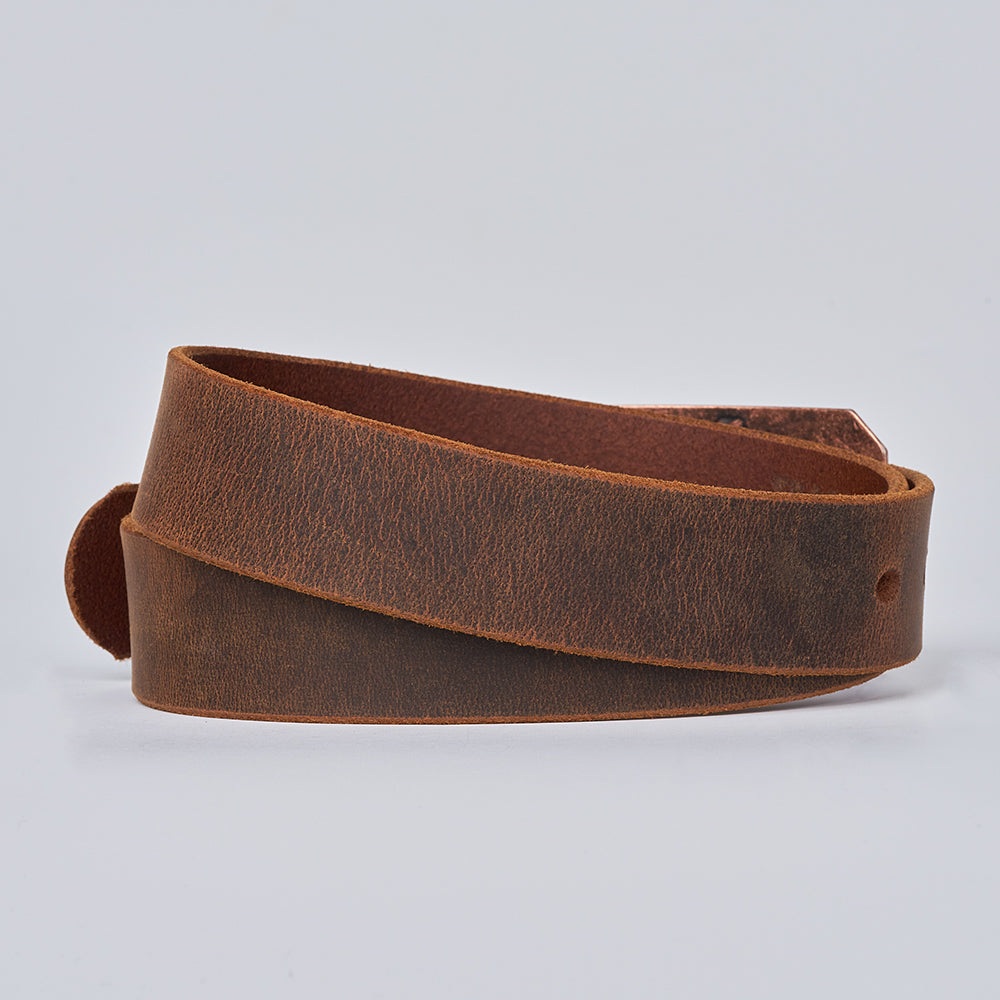 The Lainey by Hanks Belts is a coiled brown Crazy Horse leather belt with a simple, unadorned design and a slightly worn texture, shown against a plain light gray background.