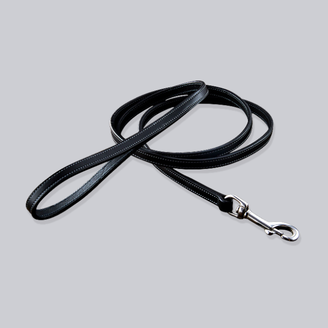 The Bentley Leash by Hanks Belts is a black English Bridle leather dog leash with white stitching and a silver clasp, shown coiled on a light gray background.