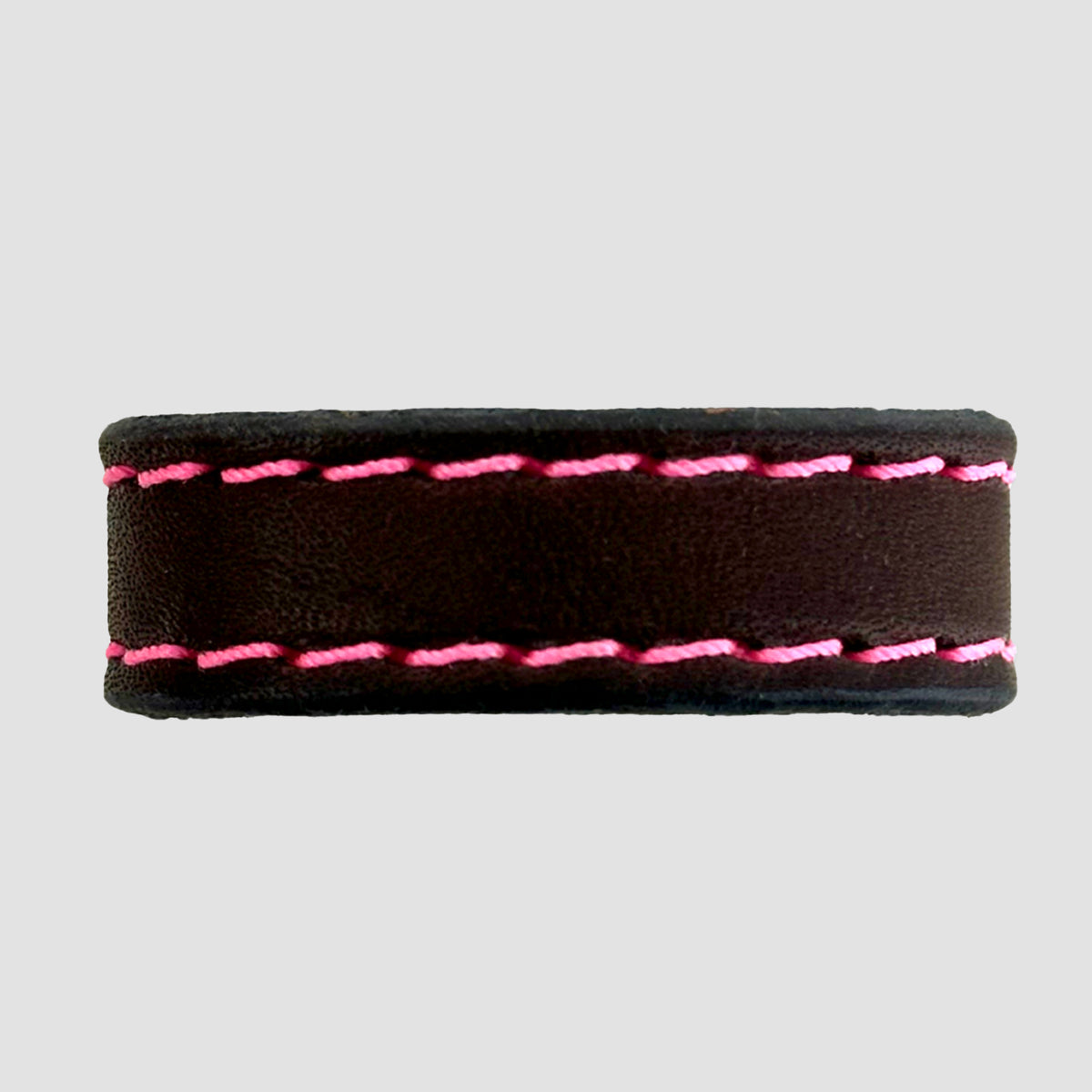 The Hanks Belts 1.25" Stitched #7 Keeper is a brown leather belt with dual rows of bright pink stitching and a sturdy keeper, shown on a plain light gray background.