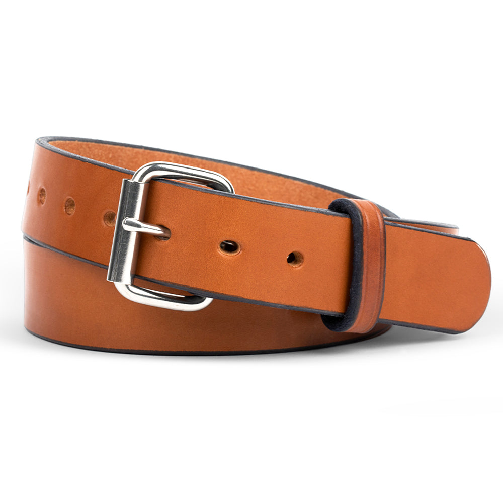 The Gunner by Hanks Belts in Oakwood is shown coiled against a white background, featuring full-grain leather and a silver rectangular buckle—ideal as a durable gun belt or rugged work belt.