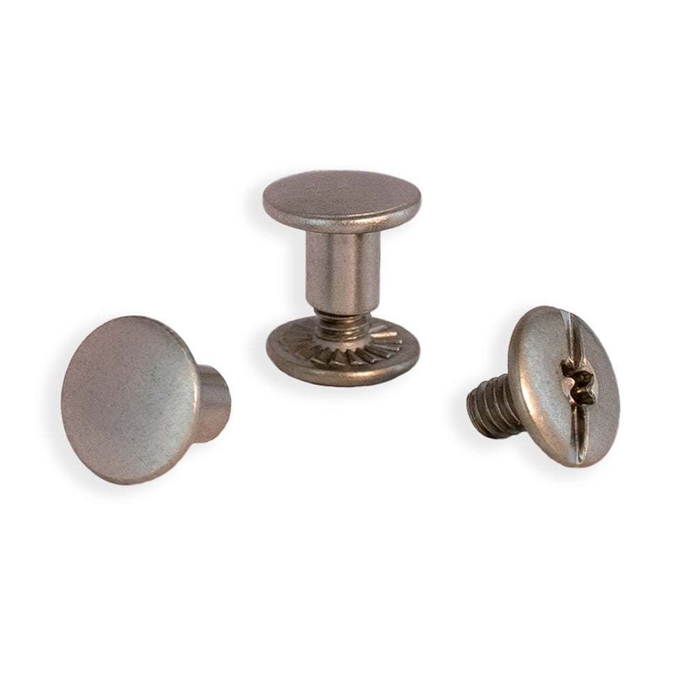 Against a white background, Hanks Belts Chicago Screws-1/4"-2 Pack are showcased. One assembled screw and two separate pieces, a smooth cap and threaded post, highlight their ideal use in securing heavy-duty belts like Hanks CCW Gun Belts.