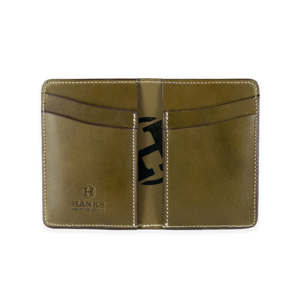 The Superior Front Pocket Bifold by Hanks Belts is an olive green, handcrafted wallet made from USA tanned English Bridle Leather. It features multiple card slots and has the "Hanks Leather Goods" logo embossed on the bottom left corner, shown against a plain white background.