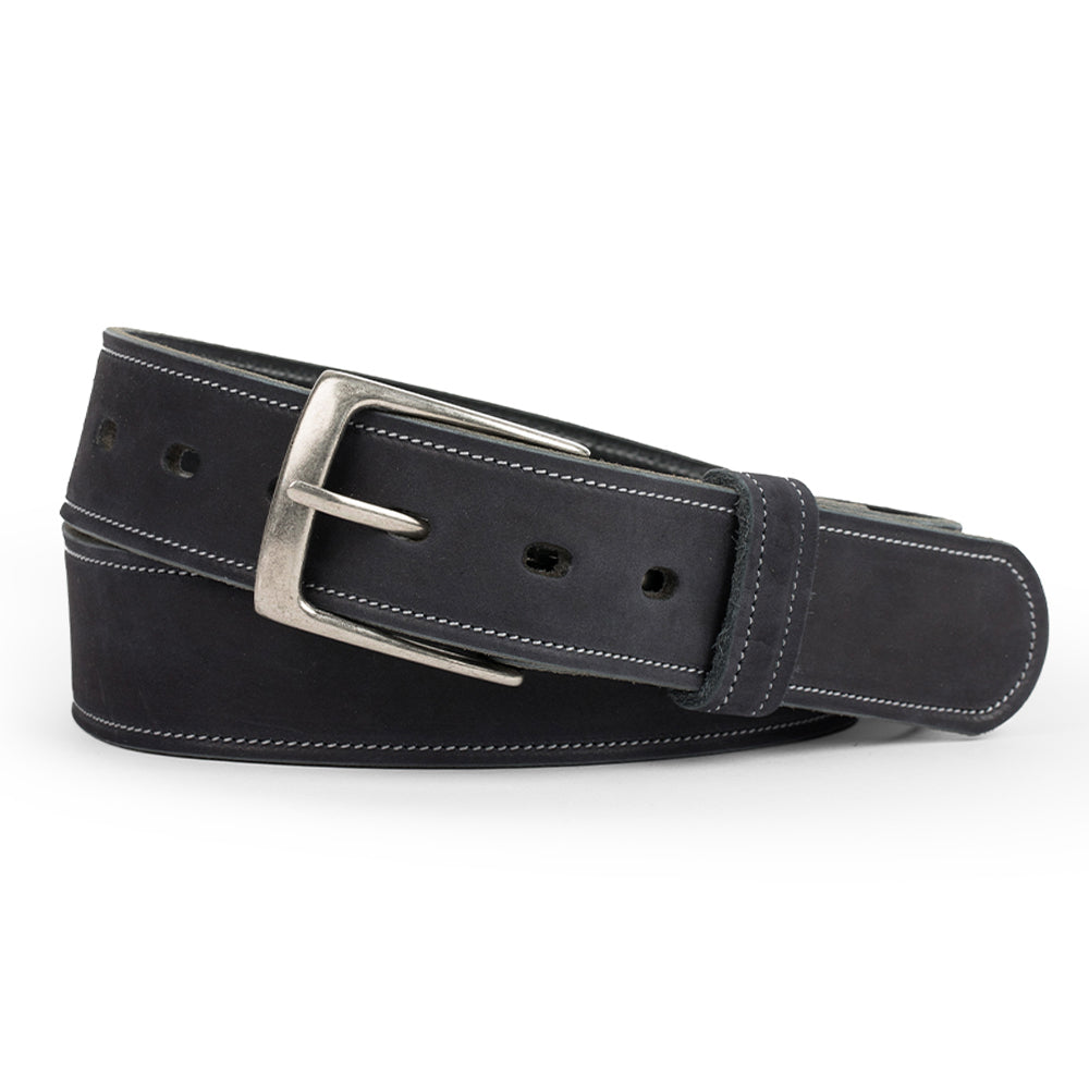 The Suede Belt - 1.5" by Hanks Belts is a black nubuck leather belt featuring white stitching and a silver buckle, made in the USA. The belt is rolled and placed against a white background.