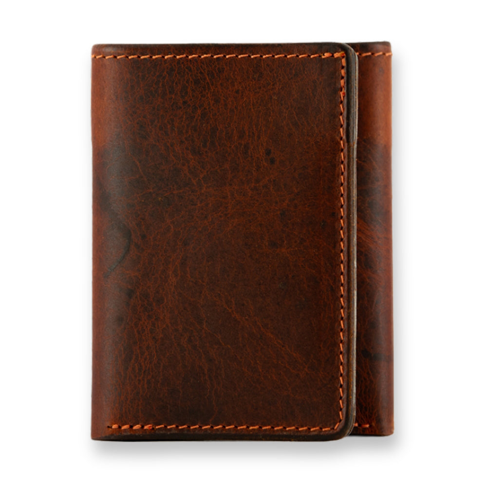 The Erie Premium Bison Trifold by Hanks Belts is a brown wallet with visible edge stitching, shown closed and upright against a white background.