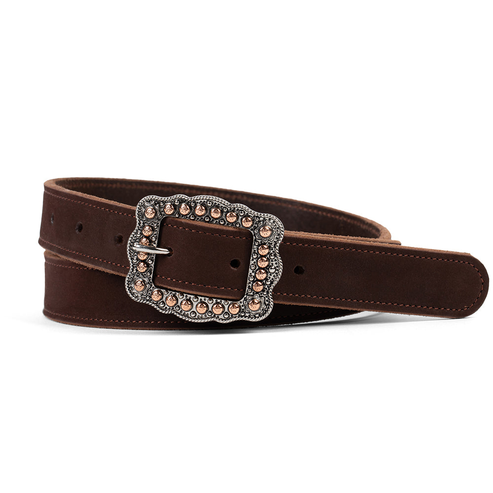 The Lennon Suede by Hanks Belts in Dark Chocolate features soft suede leather and a bold, ornate square rose gold buckle with metallic studs and detailed accents, displayed coiled on a white background.