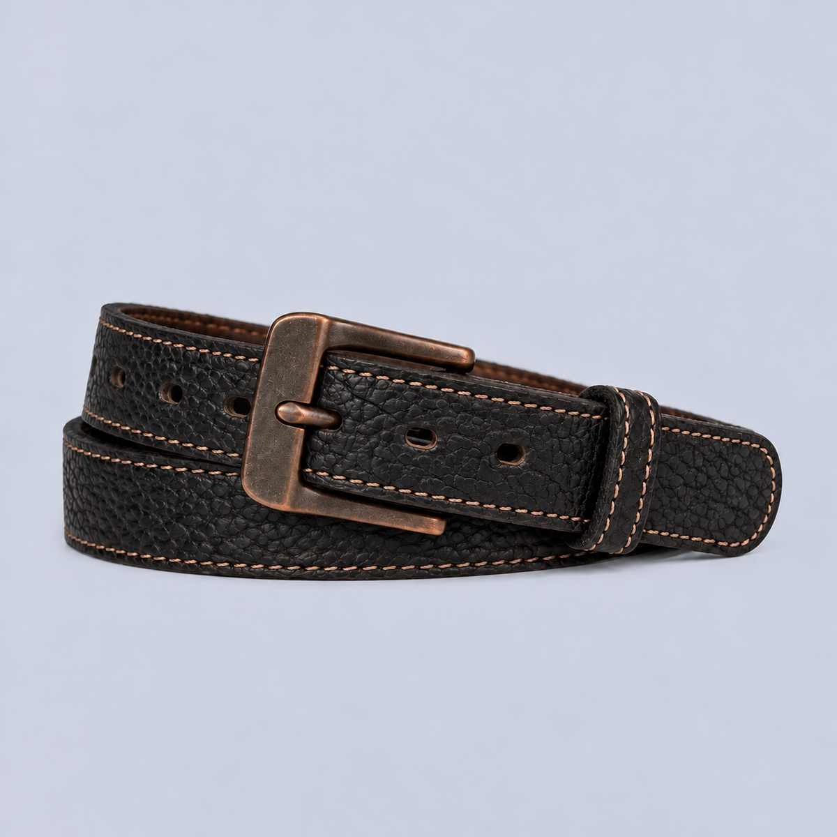 The Yellowstone - 1.25″ black textured leather belt with contrast stitching and a rectangular bronze-toned buckle.