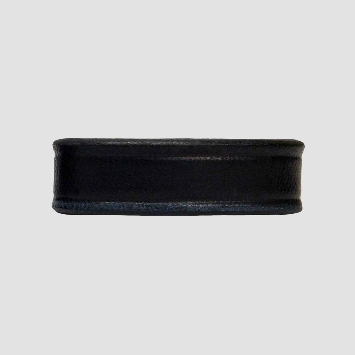 The Hanks Belts 1.5" Smooth #1 Keeper in black features a discreet, smooth matte finish—perfect for those seeking subtle style to complement 1.5-inch-wide belts and belt keepers, ideal for CCW use. Photographed on a light gray background.