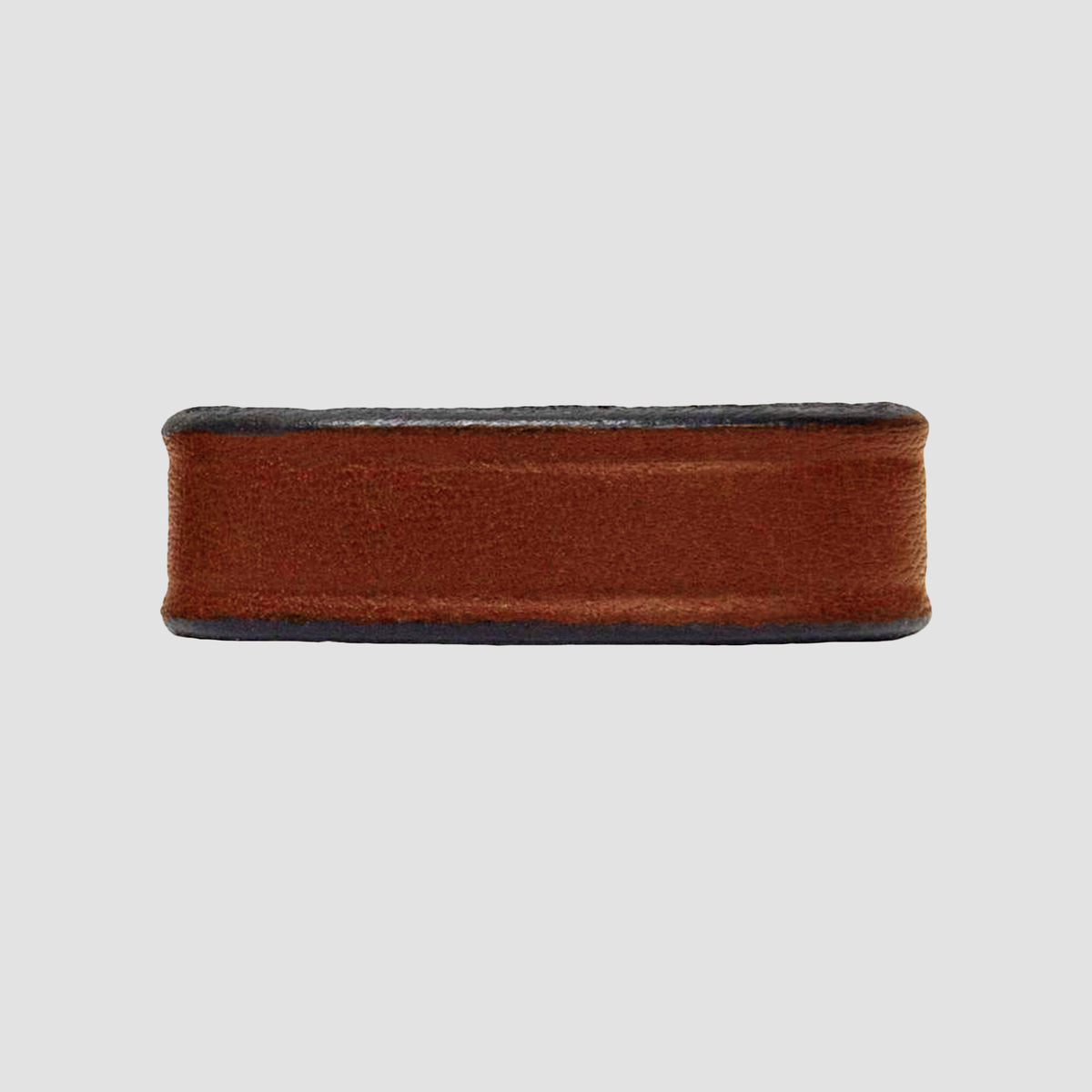 The Hanks Belts 1.5" Smooth #1 Keeper in oak features a smooth leather finish with black edges, perfect for 1.5" wide belts, showcased on a plain light gray background.