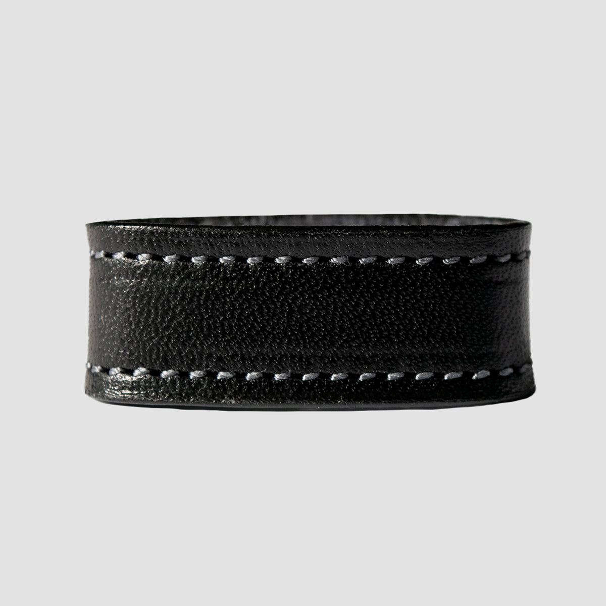 The Hanks Belts 1.25" Stitched #10 Keeper is a black leather belt keeper with two rows of grey stitching, perfect for a 1.25" dress belt, shown against a plain light grey background.