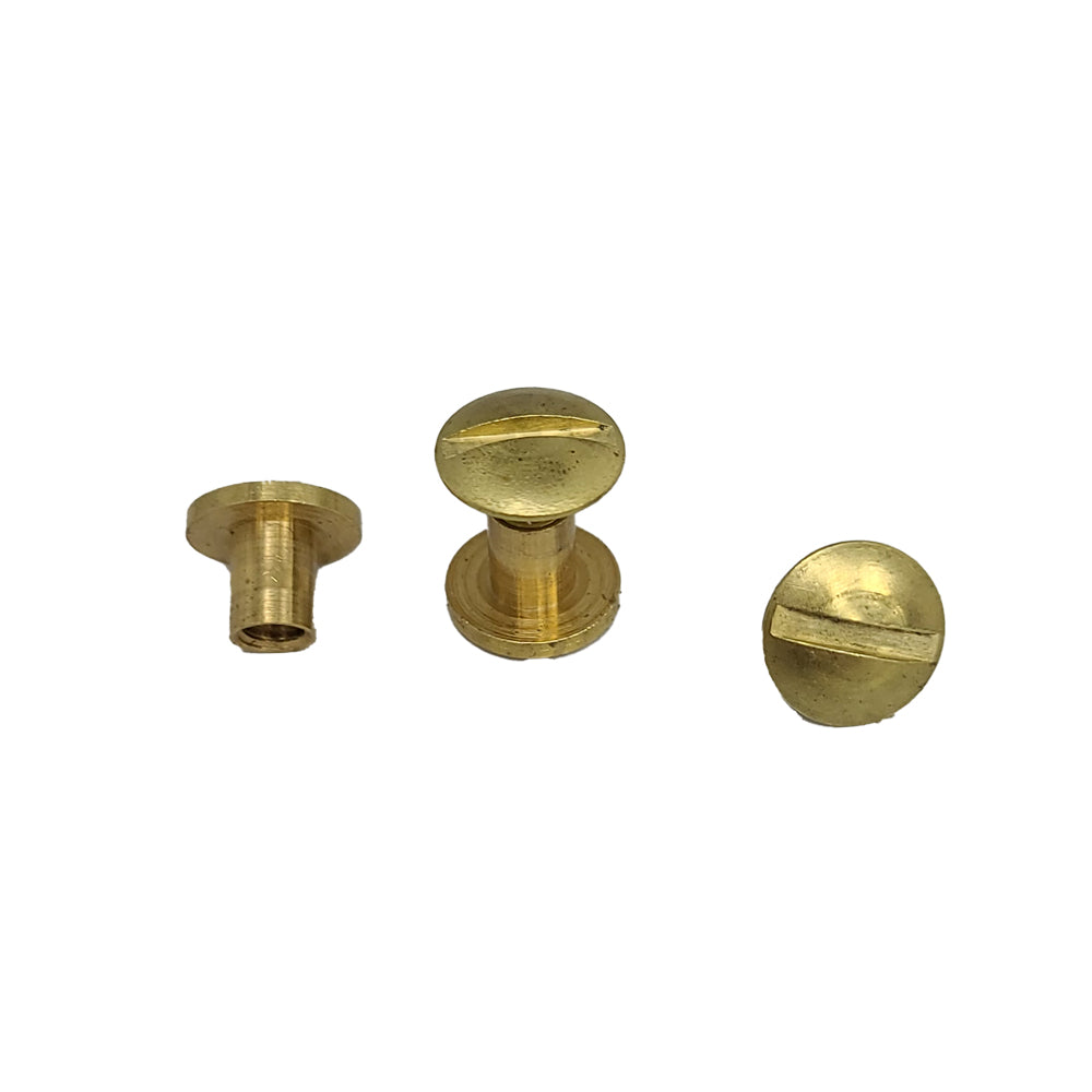 An image displays three small brass Hanks Belts Chicago Screws from the 1/4" - 2 Pack collection, each featuring flat slotted heads. One screw is positioned on its side, another stands upright, and the third faces up. These versatile screws are commonly used for binding documents but are also durable enough for heavy-duty belts.