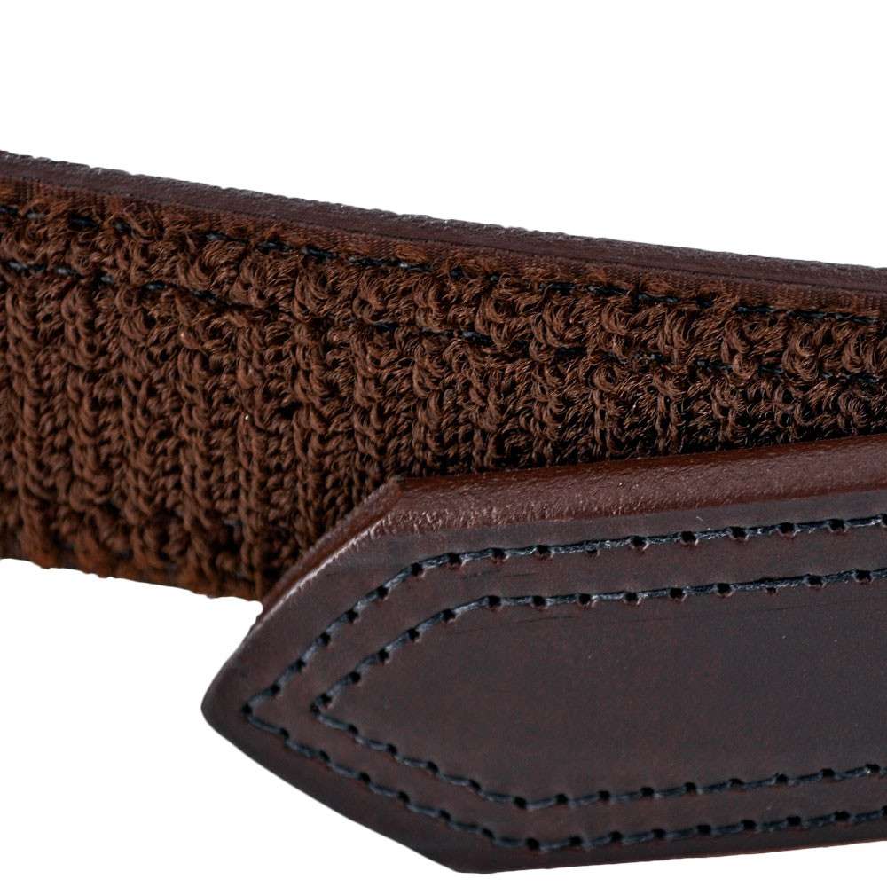 Close-up of The Scratchless Mechanics belt by Hanks Belts, featuring brown woven fabric and a dark brown full grain leather tip with visible stitching.
