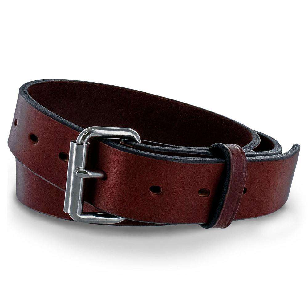 The Gunner by Hanks Belts, a coiled brown belt made of full-grain steer hide with a silver rectangular buckle and multiple adjustment holes, is displayed on a white background.