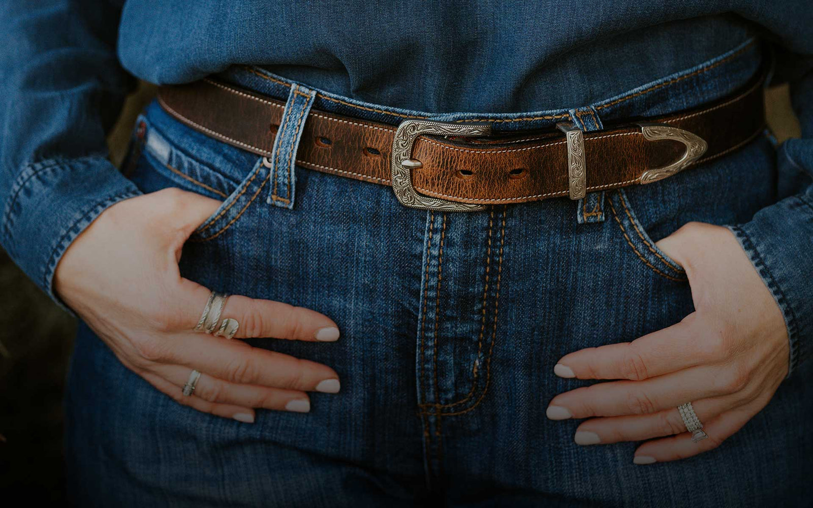 Model wearing the bison Willow belt from Hanks belt. She is wearing denim on denim with the stunning belt as the centerpiece.