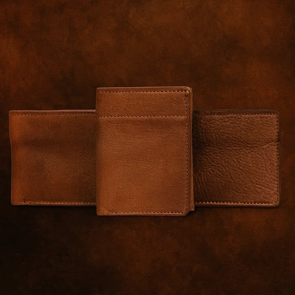 The Hanks Belts Grainmark Collection Line, crafted from brown full-grain leather, is fully opened to display its three wallets as it rests on a matching brown leather surface.