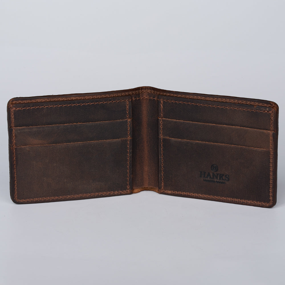 An open Hanks Belts Grainmark Line Bifold, crafted from full-grain leather with multiple card slots on each side and the &quot;HANKS&quot; logo stamped on the right interior panel, displayed against a light gray background.