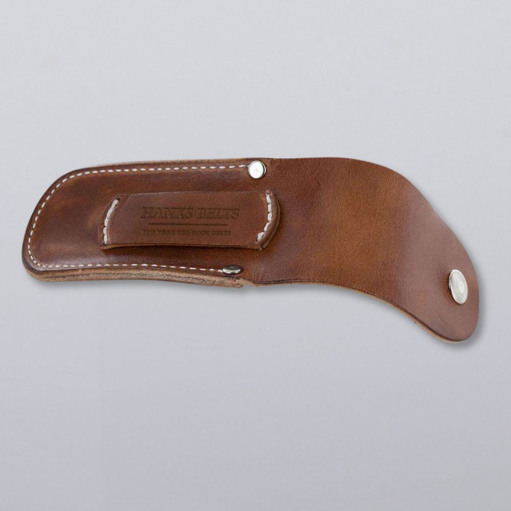 The Canyon Utility Sheath and Mag Case by Hanks Belts features brown bridle leather, white stitching, a belt loop, metal snap closures, and &quot;HANKS BELTS&quot; branding. Displayed on a plain light grey background.