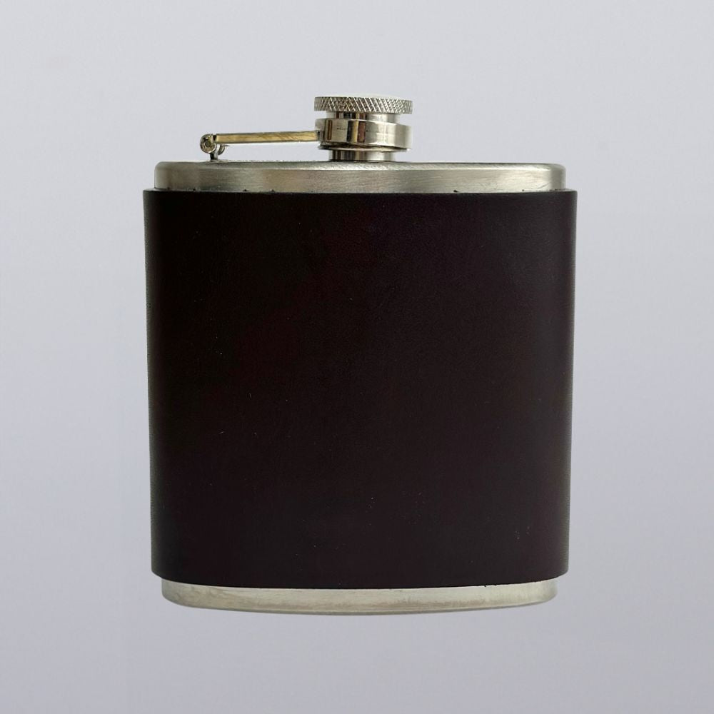 The Hanks Belts Leather Covered Flask features a dark, matte finish with a silver screw-on cap, shown isolated on a plain light background.