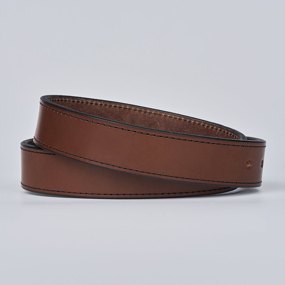 The Double Roller by Hanks Belts is a full-grain leather belt with black edges and stitching, shown coiled on a light gray background.